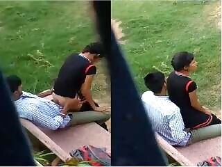 Naked couple having sex in the woods near a village